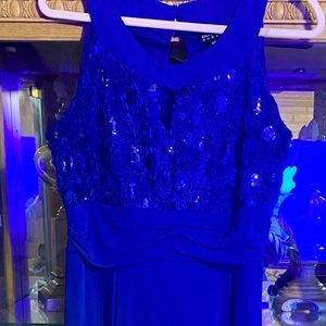 Royal blue gown key hole at top soft rose shapes at the top with blue sequins